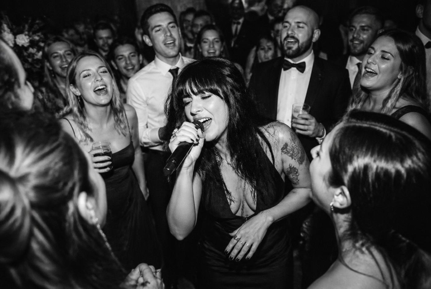 Lead singer performing in the middle of the crowd